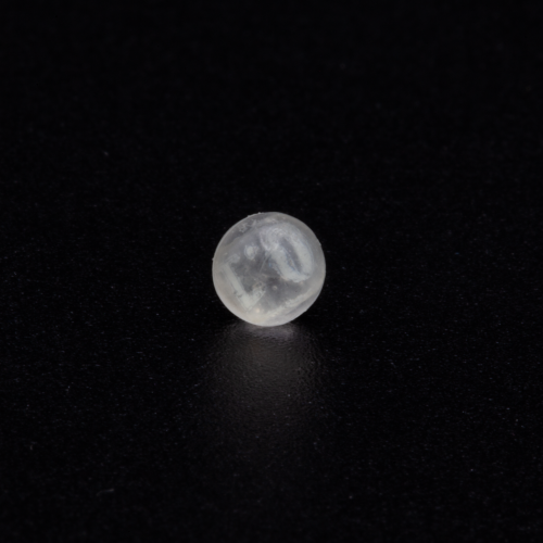 TX-1, Vivelle Dot patch fargment embedded in resin sphere, approximately 4-5mm in diameter; pre-launch photo; credit, Adriana Knouf