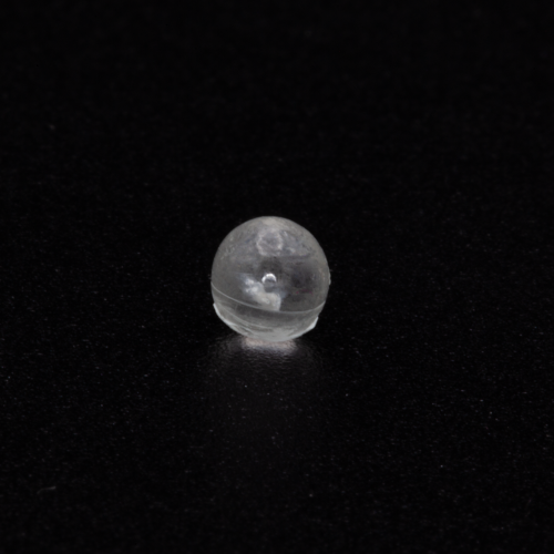 TX-1, handmade abaca paper sculpture embedded in resin sphere, approximately 4-5mm in diameter; pre-launch photo; credit, Adriana Knouf